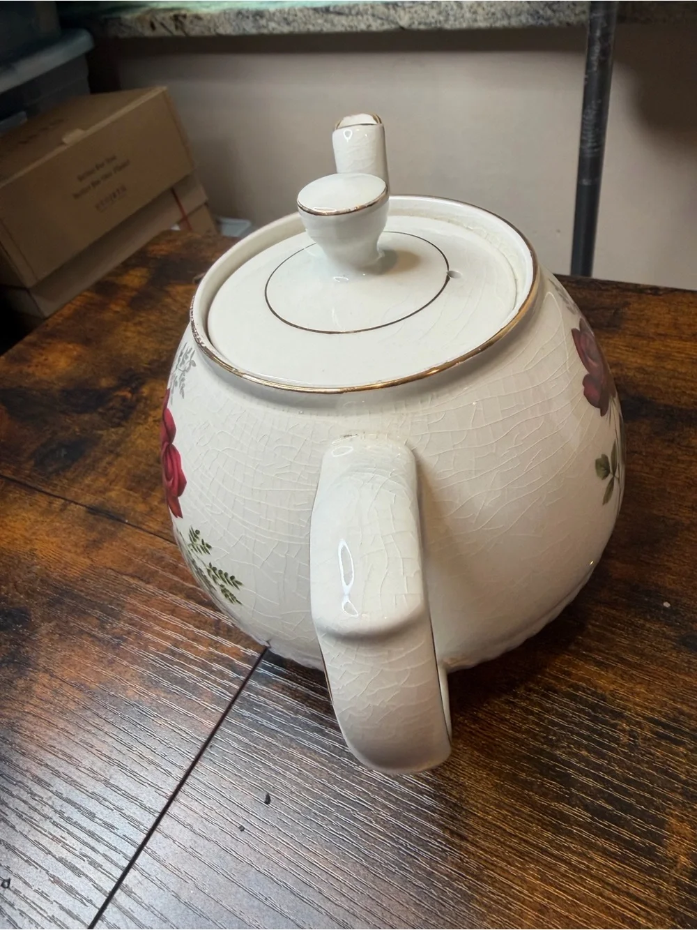 Vintage Ellgreave England red rose teapot featuring delicate gold trim.